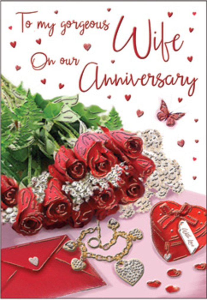 This anniversary card composition unfolds like a story told in still life, arranged with a care that mirrors the steady, enduring love it celebrates. Centre stage, a bouquet of classic red roses sits low and full, each bloom perfectly formed with layered, velvety petals that seem soft enough to touch. The red is deep and romantic, the sort of rich crimson that feels right at home in a cosy Queen's Park living room after a stroll through the park's tree-lined paths. Around the roses, slender stems of lush greenery weave in, their glossy leaves adding depth and a natural, garden-fresh contrast. Nearby, a neatly positioned envelope and open card display gentle curves of calligraphic text, the words partially visible and flowing in a graceful script, suggesting personal, heartfelt anniversary wishes. To one side rests a vivid red heart-shaped box, its surface smooth, shining softly under the ambient light, evoking the charm of a treasured keepsake kept safe over the years. Just beside it, a delicate jewellery set glints-a fine chain, perhaps with a pendant of intertwined hearts or a tiny locket-laid out with the same intention as a carefully chosen gift from a local boutique off Salusbury Road. Tiny heart motifs and shimmering accents are scattered across the backdrop, catching subtle highlights like evening lights reflected in nearby shop windows. A small butterfly motif drifts near the roses, hinting at transformation and the beauty of love that grows over time. The overall tone is tender and elegant, as if the whole arrangement has been curated for a couple marking another year together in their Queen's Park home, surrounded by memories and quiet joy.